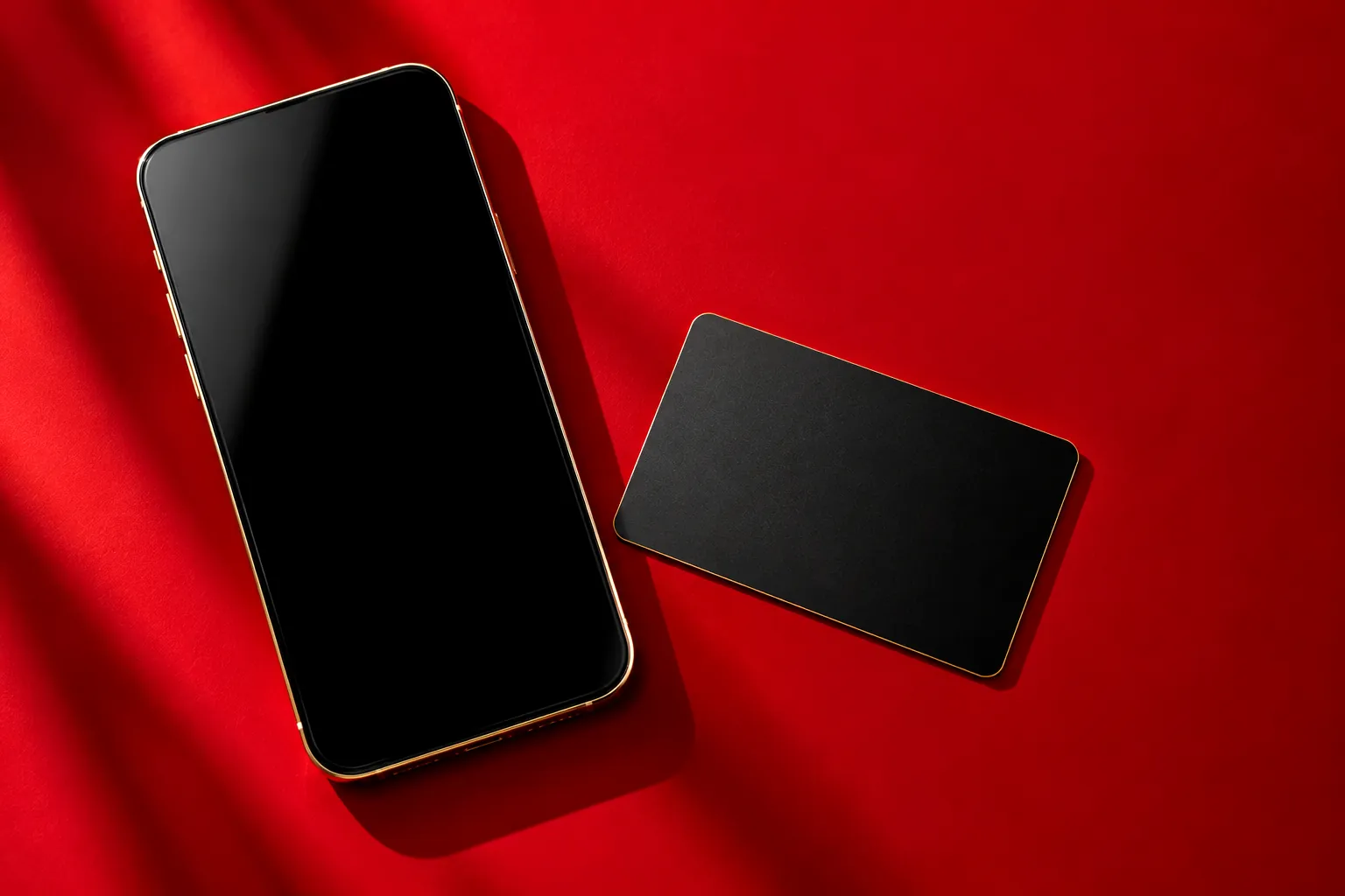 Smartphone e carta di pagamento su fondo rosso: pagamenti e rate